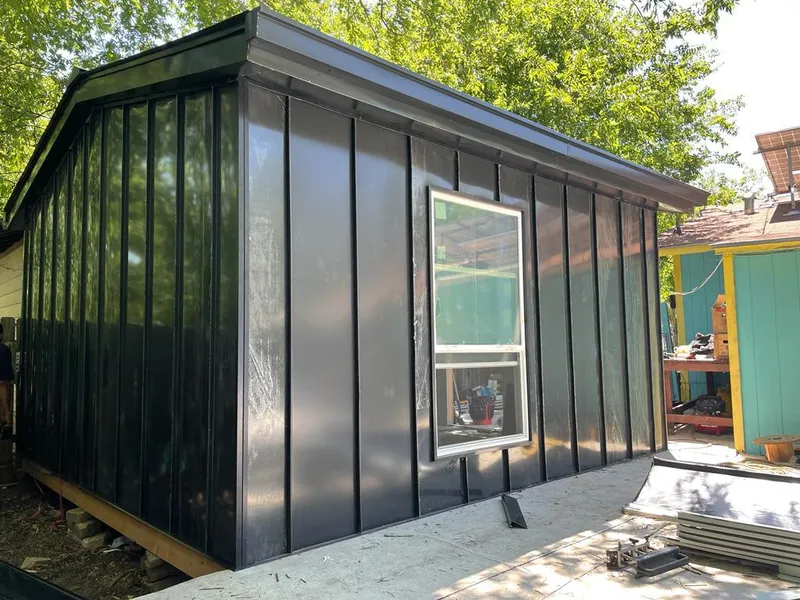 Black standing seam metal wall panels for Metal Roof Installation in Bellair-Meadowbrook Terrace