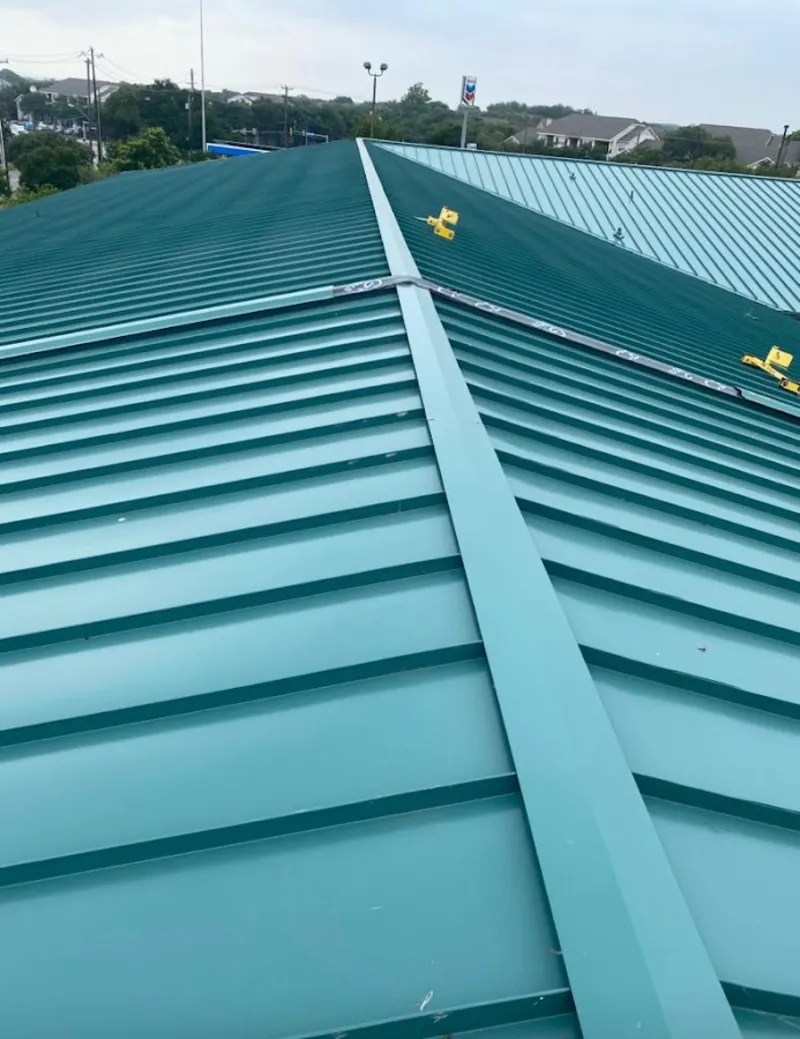 Green commercial metal roof ridge and valley for Metal Roof Repair in Bellair-Meadowbrook Terrace